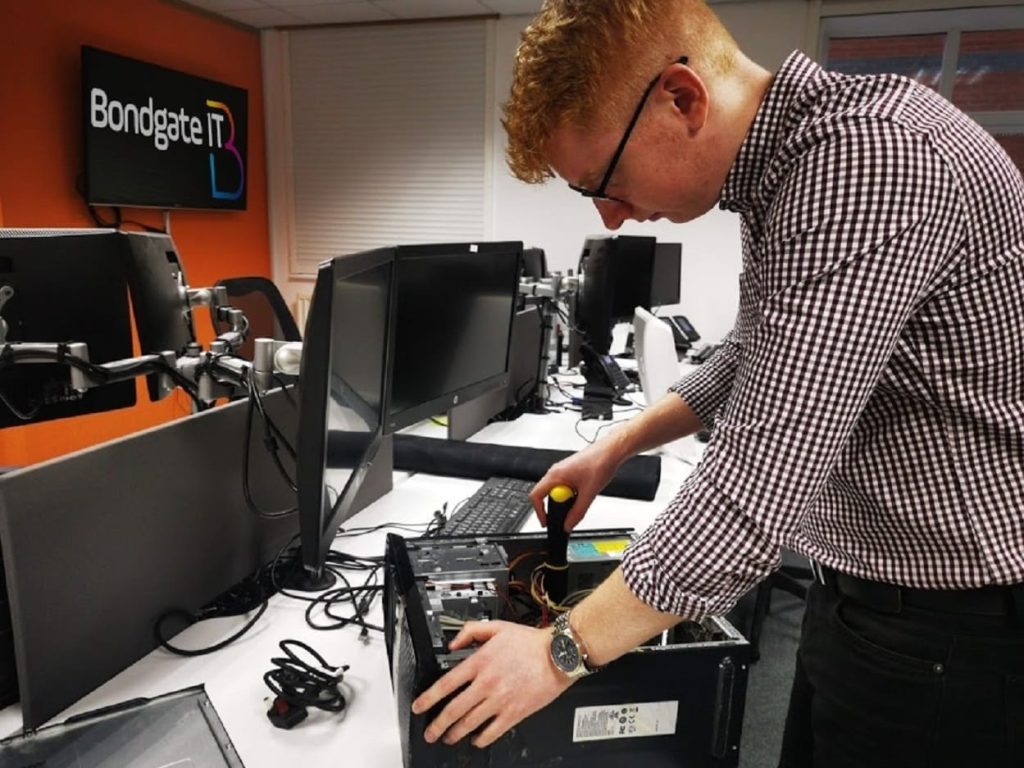 Adam Pevie of Bondgate IT refurbishes one of the computers due to be donated