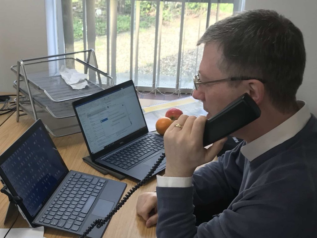 A member of the COVID Community Support Team talking on the phone