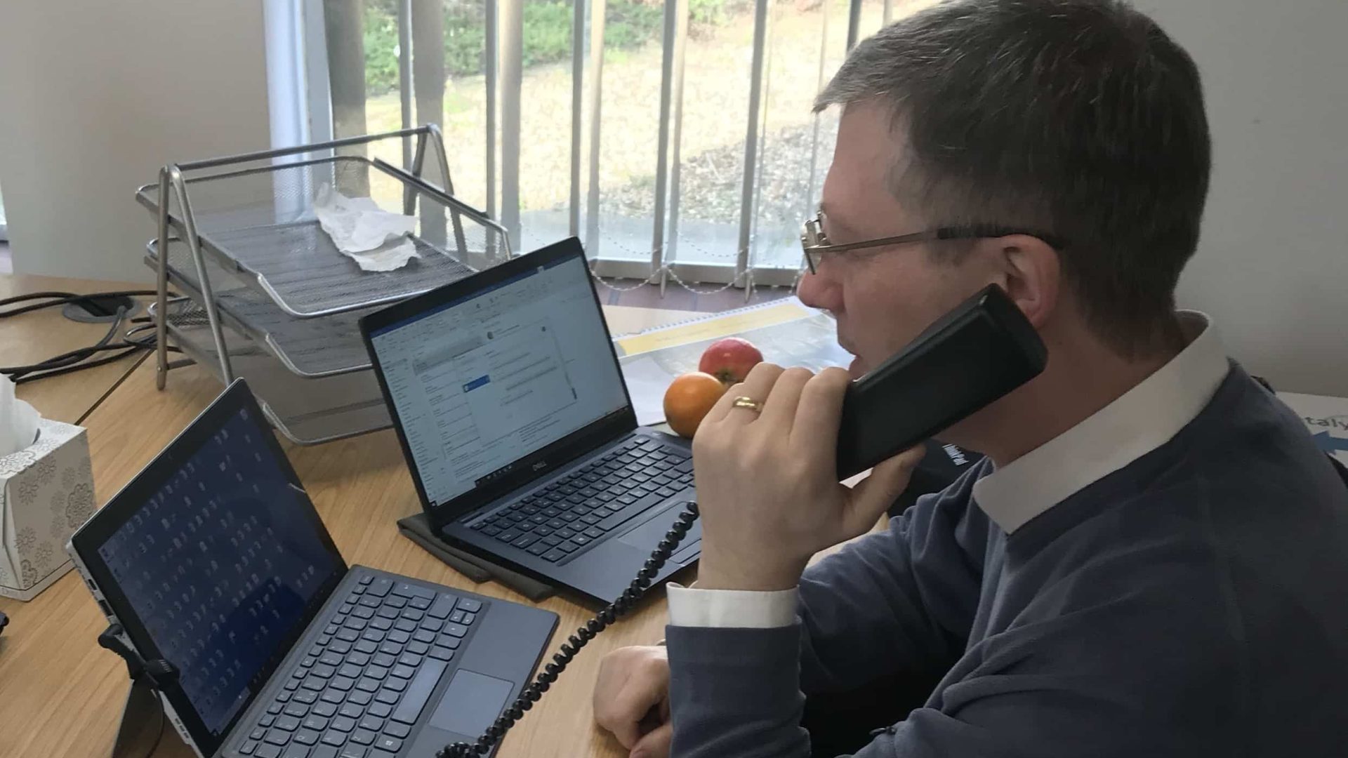 A member of the COVID Community Support Team talking on the phone